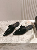 CHANEL FLAT MULES 25S IN BLACK PATENT LEATHER