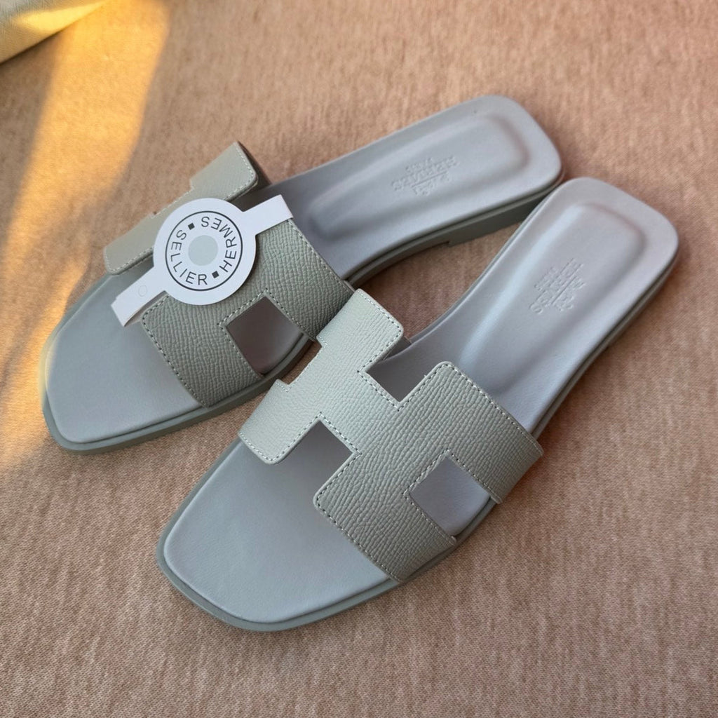HERMES 0RAN SANDALS IN WARM GRAY CALFSKIN