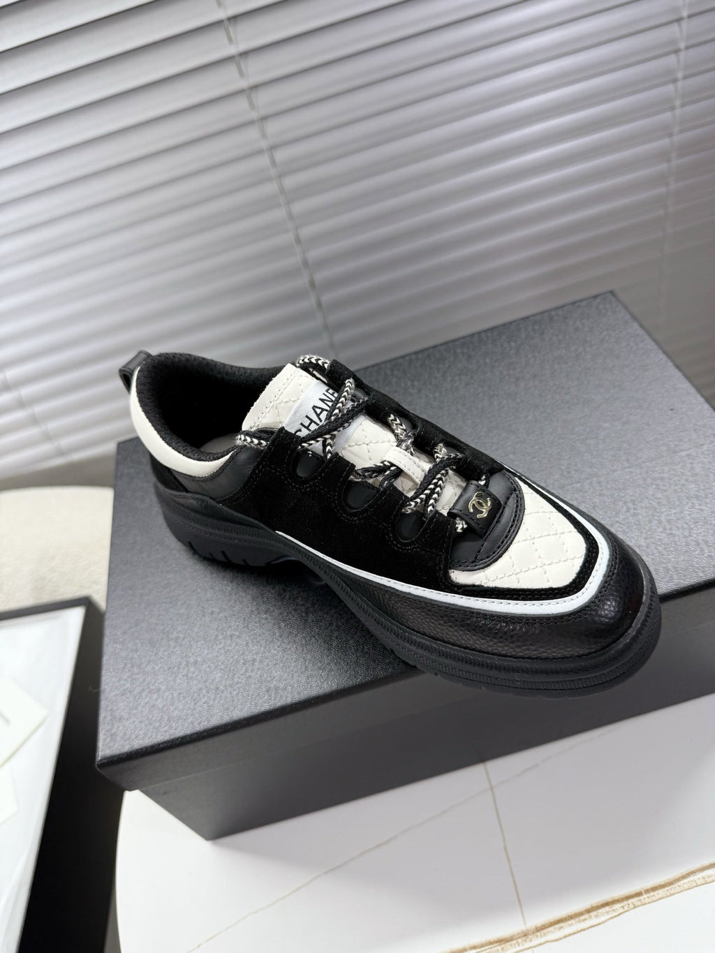 CHANEL 25S SNEAKERS 35MM IN BLACK AND WHITE CALFSKIN