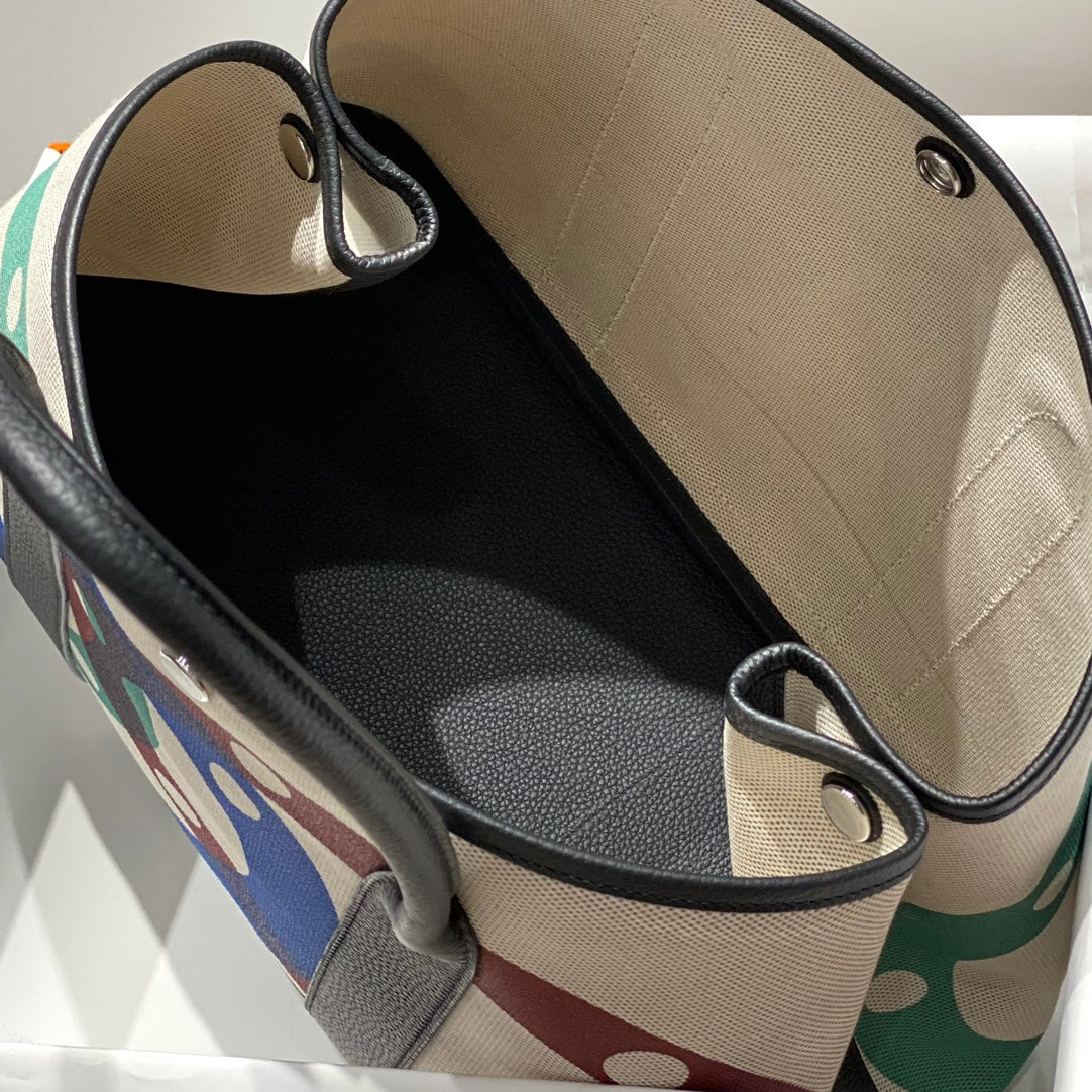 HERMES GARDEN PARTY 36 IN MULTICOLOR TOILE H CANVAS BLACK CALFSKIN OVERLAPPING POLKA RINGS PRINT