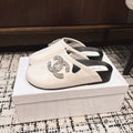 CHANEL FLAT MULES IN WHITE CALFSKIN